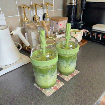 The Matcha Machine takeout cup